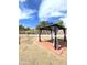 Backyard featuring a quaint patio and gazebo with privacy curtains, creating a serene and inviting outdoor space at 5952 W Morning Dove Dr, Glendale, AZ 85308