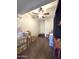 Spacious room with dark wooden floors, a ceiling fan, and ample space for various uses at 5952 W Morning Dove Dr, Glendale, AZ 85308