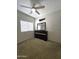Bedroom with a ceiling fan, window, and closet at 5952 W Morning Dove Dr, Glendale, AZ 85308