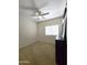 Bedroom with a ceiling fan and window at 5952 W Morning Dove Dr, Glendale, AZ 85308