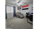 Bedroom featuring recliner, desk and blinds at 5952 W Morning Dove Dr, Glendale, AZ 85308