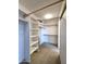 Walk-in closet with multiple shelves and rods, offering ample storage solutions at 5952 W Morning Dove Dr, Glendale, AZ 85308