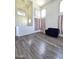 Welcoming entryway features hardwood floors and double front doors at 5952 W Morning Dove Dr, Glendale, AZ 85308