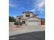 Charming two-story home with stucco exterior, red tile roof, and well-manicured desert landscaping at 5952 W Morning Dove Dr, Glendale, AZ 85308