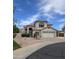 Charming two-story home with stucco exterior, red tile roof, and well-manicured desert landscaping at 5952 W Morning Dove Dr, Glendale, AZ 85308