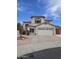 Charming two-story home with stucco exterior, red tile roof, a mountain view and a two-car garage at 5952 W Morning Dove Dr, Glendale, AZ 85308