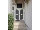 A well-lit front entryway with security doors at 5952 W Morning Dove Dr, Glendale, AZ 85308