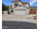 Charming two-story home with stucco exterior, red tile roof, and a two-car garage at 5952 W Morning Dove Dr, Glendale, AZ 85308