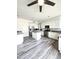 Bright kitchen with granite countertops, stainless steel appliances, and wood-look flooring at 5952 W Morning Dove Dr, Glendale, AZ 85308