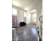 Bright living room with hardwood floors and multiple windows at 5952 W Morning Dove Dr, Glendale, AZ 85308