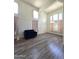 Bright living room features wood floors and high ceilings at 5952 W Morning Dove Dr, Glendale, AZ 85308