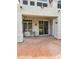 Covered patio with brick flooring and sliding glass door at 5952 W Morning Dove Dr, Glendale, AZ 85308