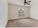 This spacious bedroom with lots of light coming in through the large window offers a serene retreat at 6 E Piping Rock Rd, Phoenix, AZ 85022