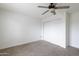 Bright, spacious bedroom with carpet and a closet, offering comfort and functionality at 6 E Piping Rock Rd, Phoenix, AZ 85022