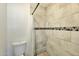 Bathroom shower showcasing neutral tile, decorative border and a clear shower curtain at 623 W Guadalupe Rd # 213, Mesa, AZ 85210