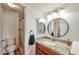 Well-lit bathroom features granite counters, round mirror, and a shower with a curtain at 623 W Guadalupe Rd # 213, Mesa, AZ 85210