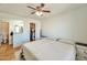 Cozy bedroom featuring ensuite bathroom, walk-in closet, ceiling fan and a nightstand at 623 W Guadalupe Rd # 213, Mesa, AZ 85210