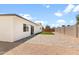 Spacious backyard featuring an extended patio and low maintenance artificial turf at 6332 W Sunnyslope Ln, Glendale, AZ 85302