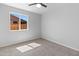 Bedroom showcases neutral walls, carpet and a window overlooking an outdoor fence at 6332 W Sunnyslope Ln, Glendale, AZ 85302