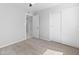 Neutral bedroom features carpet, ceiling fan and closet with sliding doors at 6332 W Sunnyslope Ln, Glendale, AZ 85302