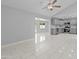 Bright and airy living room with modern finishes, tile flooring, and neutral paint at 6332 W Sunnyslope Ln, Glendale, AZ 85302