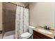 Bathroom with shower and tub, vanity and ample counter space and modern fixtures at 6459 W Columbus Ave, Phoenix, AZ 85033