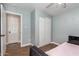 Well-lit bedroom with light blue walls, closet and ceiling fan at 6459 W Columbus Ave, Phoenix, AZ 85033