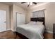 A comfortable bedroom featuring neutral tones and a large closet for ample storage at 6459 W Columbus Ave, Phoenix, AZ 85033