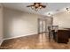 Open dining area featuring tiled floors, ceiling fan, and a granite topped breakfast bar with seating at 6459 W Columbus Ave, Phoenix, AZ 85033