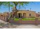 Inviting home with a well-manicured lawn, complemented by a stylish decorative metal fence at 6459 W Columbus Ave, Phoenix, AZ 85033