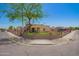 Inviting home with a well-manicured lawn, complemented by a stylish decorative metal fence at 6459 W Columbus Ave, Phoenix, AZ 85033