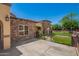 Exterior angle view featuring stonework, a green lawn, and a decorative metal fence at 6459 W Columbus Ave, Phoenix, AZ 85033