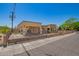 Charming home featuring beautiful stonework, a gated yard, and a covered parking area at 6459 W Columbus Ave, Phoenix, AZ 85033