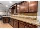 Well-appointed kitchen with granite countertops, tile backsplash, and ample cabinet space at 6459 W Columbus Ave, Phoenix, AZ 85033