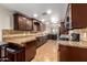 Modern kitchen featuring granite countertops, tile backsplash, and stainless steel appliances at 6459 W Columbus Ave, Phoenix, AZ 85033