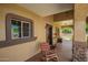 Welcoming covered porch with tile flooring, rocking chair, and decorative details at 6459 W Columbus Ave, Phoenix, AZ 85033