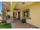 Welcoming covered porch with tile flooring, rocking chair, and decorative details at 6459 W Columbus Ave, Phoenix, AZ 85033