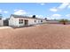 Spacious backyard featuring a covered patio and low-maintenance rock landscaping at 6908 W Sierra St, Peoria, AZ 85345