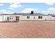 Spacious backyard with white-washed stucco, covered patio, and low maintenance rock landscaping at 6908 W Sierra St, Peoria, AZ 85345