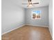 Vacant bedroom showcases tile flooring, a ceiling fan, and natural light at 6908 W Sierra St, Peoria, AZ 85345