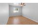 Well-lit bedroom features tile flooring, a window, and a ceiling fan at 6908 W Sierra St, Peoria, AZ 85345