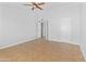 Bedroom featuring neutral paint, ceiling fan, and access to additional rooms at 6908 W Sierra St, Peoria, AZ 85345
