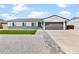 Charming single-story home with a well-maintained front yard and modern gray accents at 6908 W Sierra St, Peoria, AZ 85345