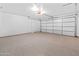 Clean and expansive two car garage with epoxy flooring and automatic door at 6908 W Sierra St, Peoria, AZ 85345