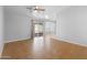Bright living room featuring tile floors, sliding glass door, and ceiling fan at 6908 W Sierra St, Peoria, AZ 85345