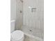 Modern tiled shower features stone-look tile flooring and built-in niche at 6908 W Sierra St, Peoria, AZ 85345