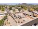 Aerial view of a desert home surrounded by lush landscaping, mountains in the background at 6988 W Monte Lindo --, Glendale, AZ 85310