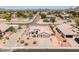 Aerial shot showcasing a single-Gathering home with well-maintained landscaping and a neutral desert color palette at 6988 W Monte Lindo --, Glendale, AZ 85310