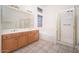 Bathroom showcasing a double vanity, soaking tub, and walk-in shower at 6988 W Monte Lindo --, Glendale, AZ 85310