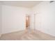 Bedroom featuring neutral carpet, closet, and views to another room at 6988 W Monte Lindo --, Glendale, AZ 85310